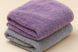 Why does a velvet towel become rough after a few washes, and how can it be softened?